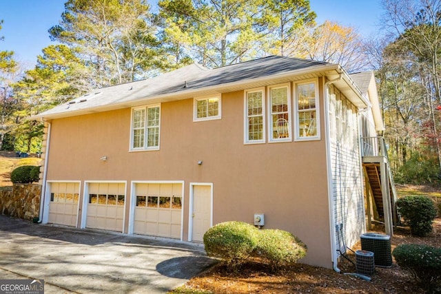 view of property exterior with a garage