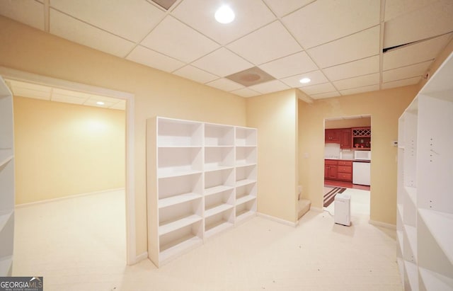 corridor featuring a paneled ceiling