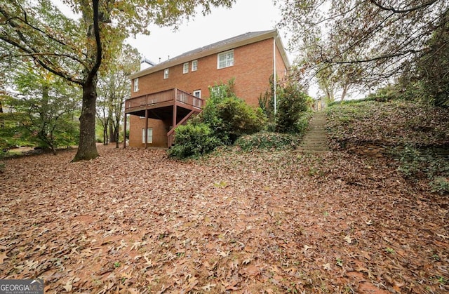 back of house featuring a deck