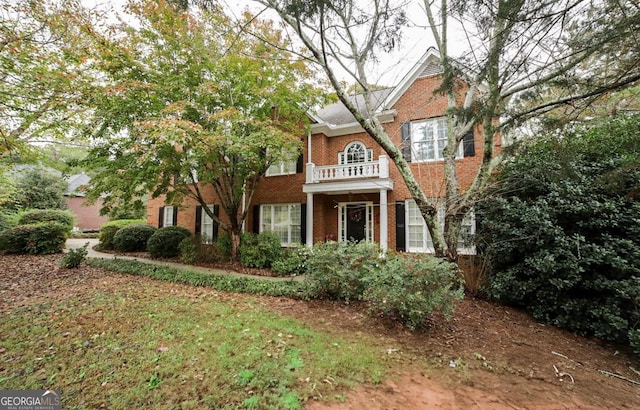 view of front of home with a balcony