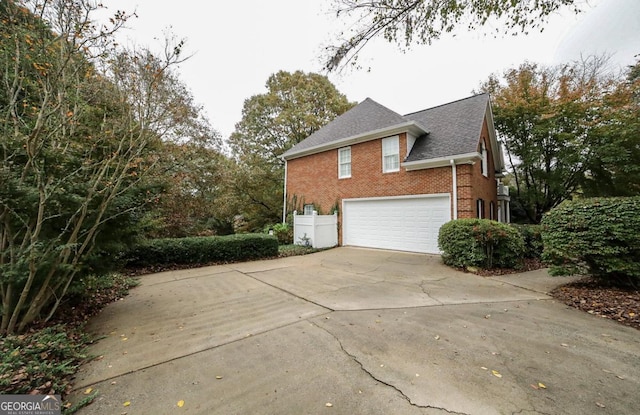 view of property exterior with a garage