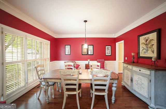 dining space with dark hardwood / wood-style floors, a healthy amount of sunlight, and crown molding