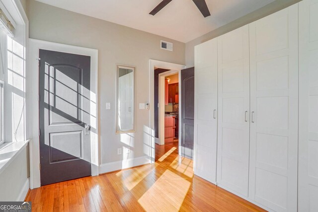 interior space featuring light hardwood / wood-style flooring and ceiling fan