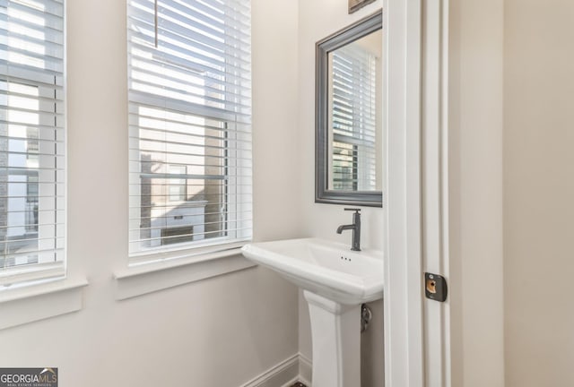 empty room with light colored carpet, ceiling fan, and crown molding