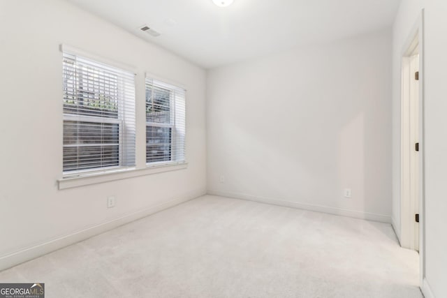 empty room with light colored carpet