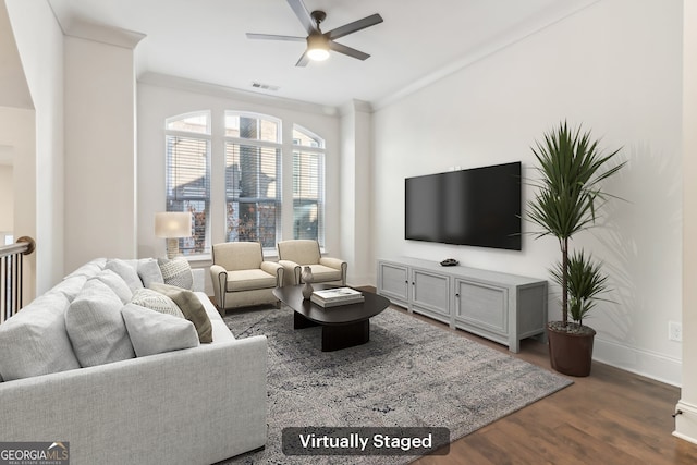 unfurnished living room featuring dark hardwood / wood-style flooring, ceiling fan, plenty of natural light, and crown molding