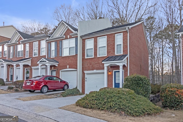 multi unit property featuring a garage