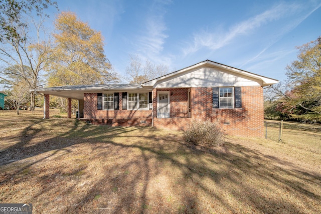 single story home with a carport and a front yard