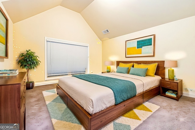 bedroom featuring light carpet and vaulted ceiling