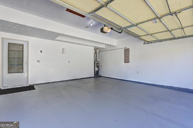 garage with electric panel and a garage door opener