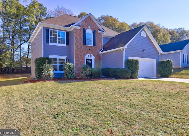 view of front property featuring a front yard and a garage