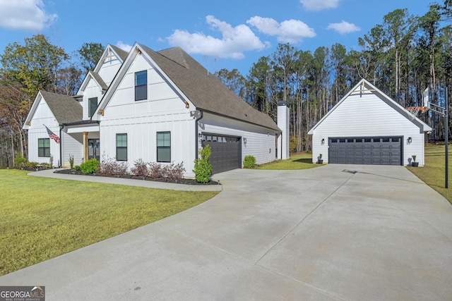 modern farmhouse style home featuring a front yard and a garage