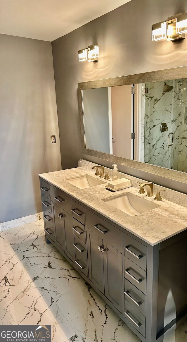 bathroom with vanity and a shower with shower door