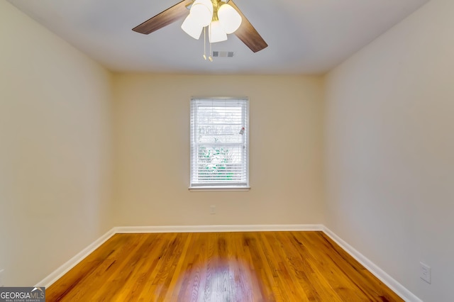 unfurnished room featuring ceiling fan and wood-type flooring