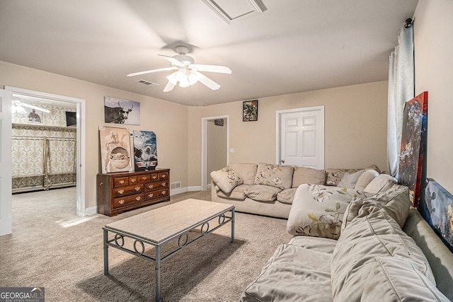 carpeted living room featuring ceiling fan