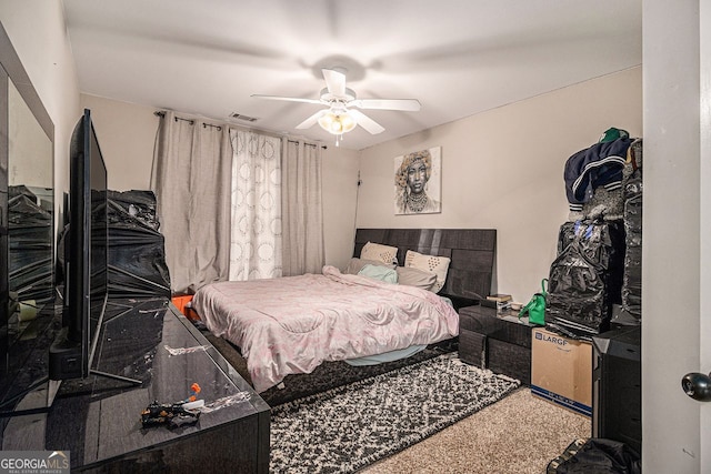 carpeted bedroom with ceiling fan