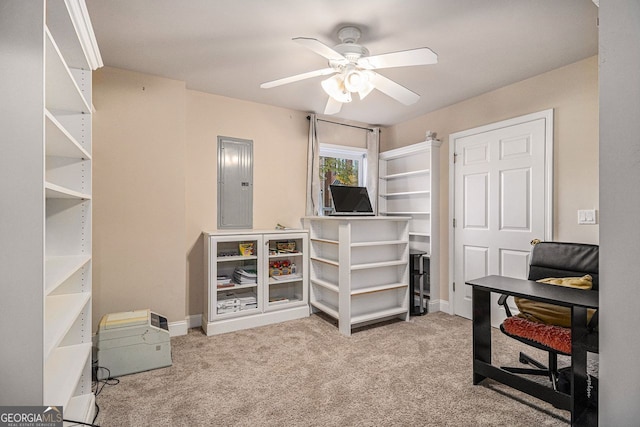 office area featuring carpet flooring, electric panel, and ceiling fan