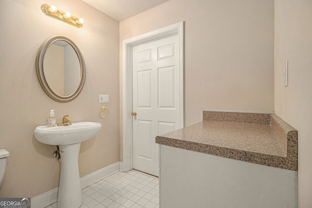 bathroom featuring tile patterned floors and sink