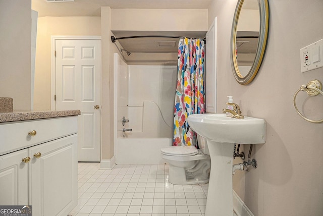 full bathroom with shower / bath combo, toilet, tile patterned floors, and sink