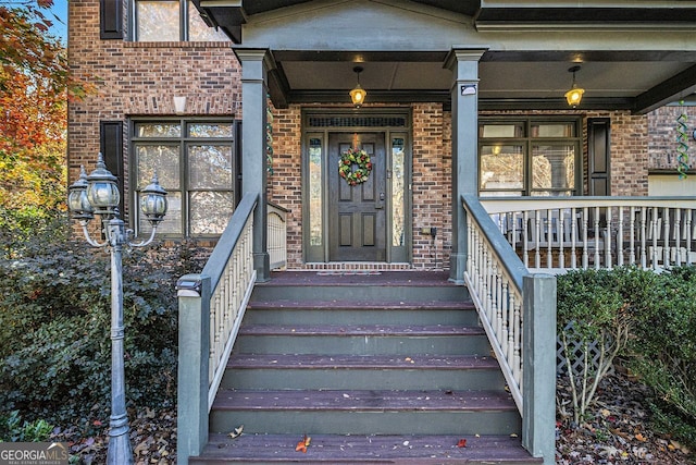 doorway to property with a porch