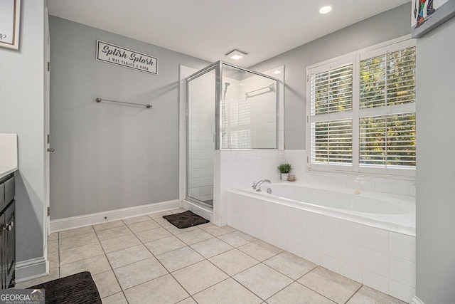 bathroom featuring tile patterned floors, a wealth of natural light, and plus walk in shower