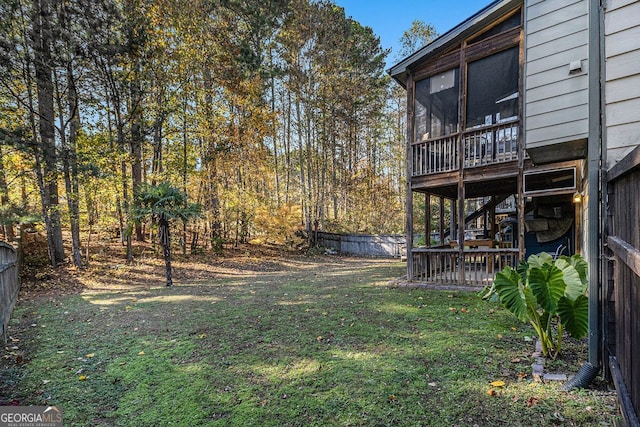 view of yard featuring a sunroom