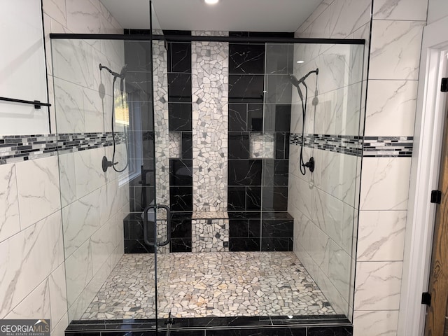 bathroom with a shower with shower door