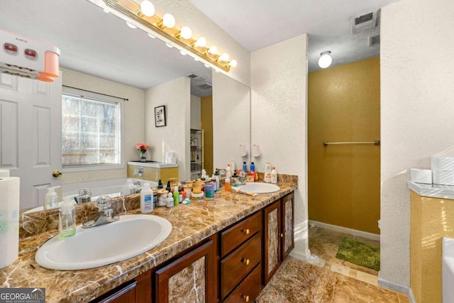 bathroom featuring a bathtub and vanity