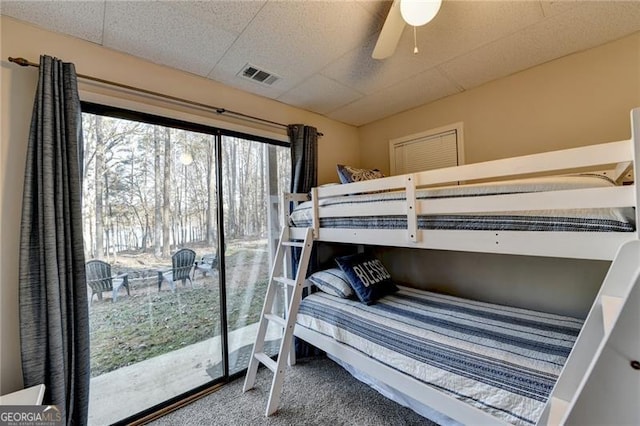 carpeted bedroom with access to outside and ceiling fan