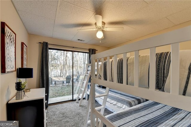 carpeted bedroom featuring ceiling fan and access to outside