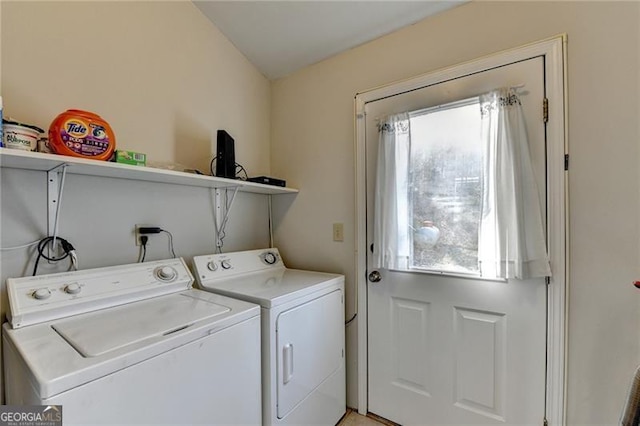 washroom featuring washer and dryer and plenty of natural light