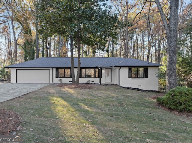 ranch-style home featuring a garage and a front lawn