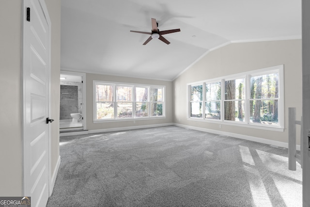 unfurnished living room featuring carpet, ceiling fan, and vaulted ceiling