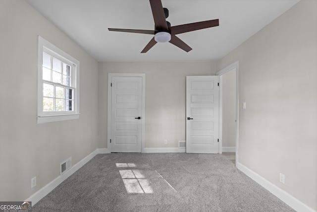 unfurnished bedroom with carpet and ceiling fan