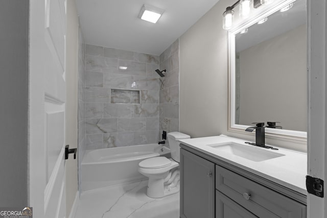 full bathroom featuring vanity, tiled shower / bath combo, and toilet