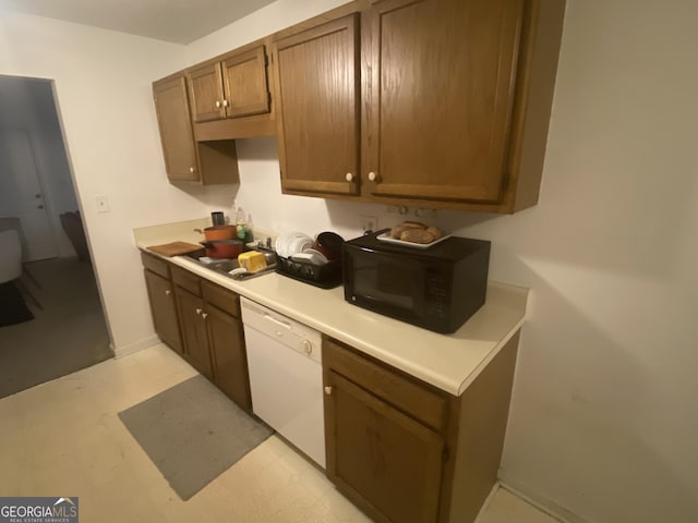 kitchen with white dishwasher and sink