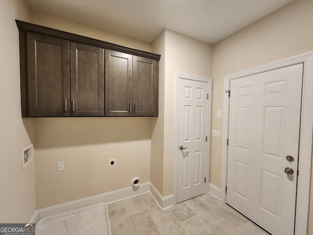 washroom featuring hookup for a washing machine, cabinets, and hookup for an electric dryer