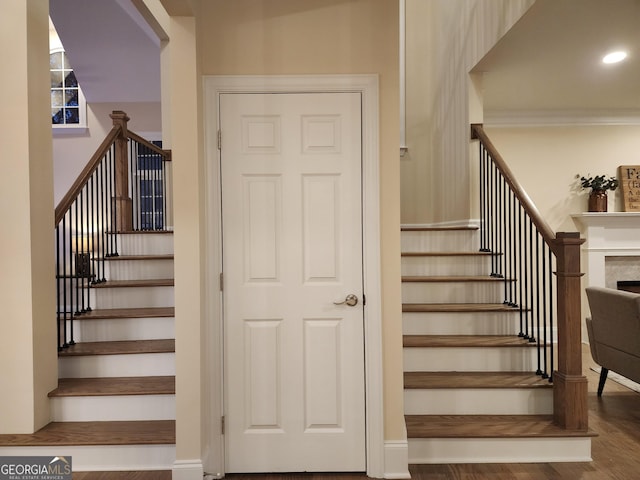 stairs with wood-type flooring