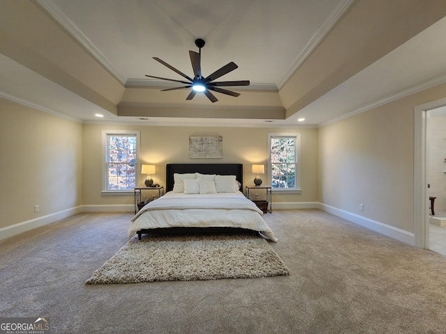 carpeted bedroom featuring a raised ceiling, crown molding, and ceiling fan