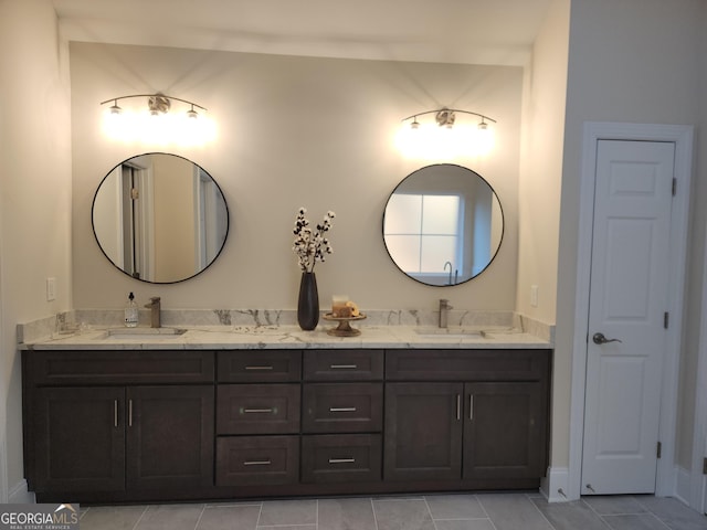 bathroom featuring tile patterned flooring and vanity