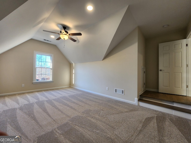 bonus room with ceiling fan, light colored carpet, and lofted ceiling