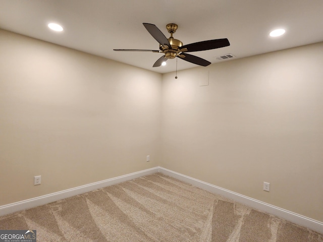 unfurnished room with ceiling fan and carpet floors