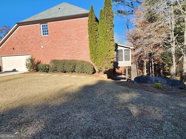 view of side of property featuring a sunroom