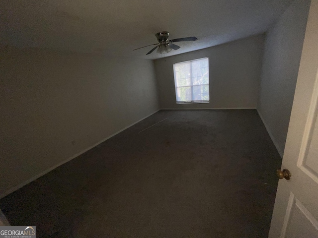 unfurnished room with ceiling fan