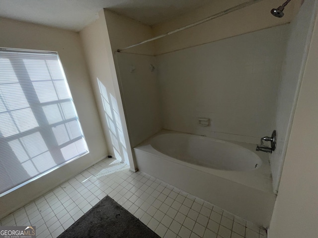 bathroom featuring tile patterned flooring and shower / bathtub combination