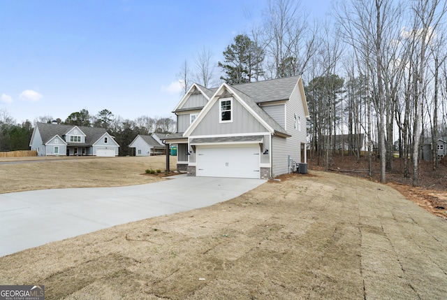 view of home's exterior featuring cooling unit and a garage