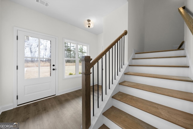 entrance foyer featuring dark hardwood / wood-style floors