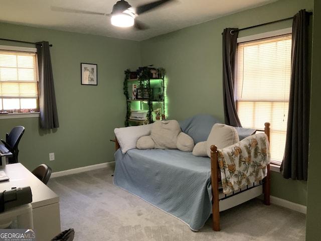 bedroom featuring carpet flooring, baseboards, and a ceiling fan