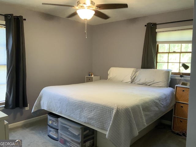 carpeted bedroom with ceiling fan