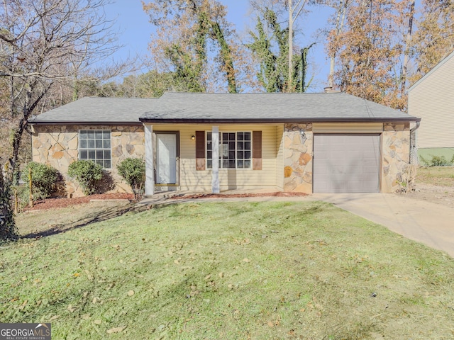 ranch-style house with a garage and a front lawn